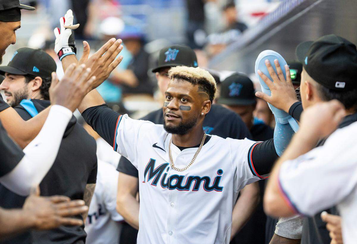Miami Marlins second base Otto Lopez (6) celebrates after scoring a run against the Pittsburgh Pirates in the eighth inning of their Opening Day MLB game at loanDepot park on Thursday, March 27, 2025, in Miami, Fla.