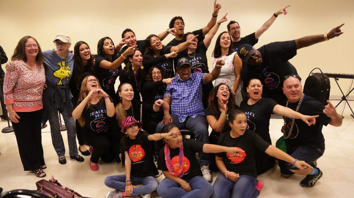 Miami-Dade County teachers and students are pictured above with Sam Moore, center, Rock & Roll Hall of Famer and member of the former music group Sam & Dave, after a performance celebrating the county’s new partnership with Little Kids Rock called Modern Band Miami.