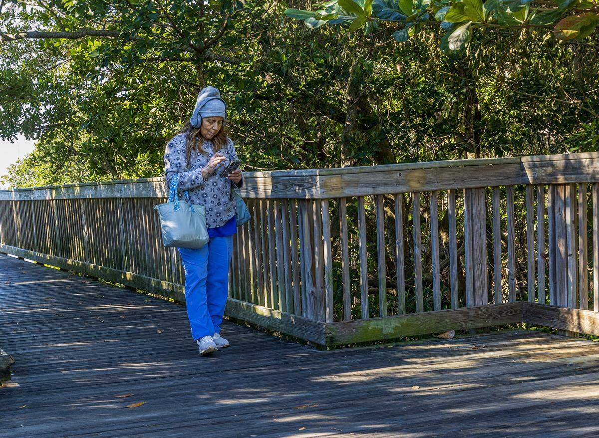 The cold temperatures didn't stop Diana Barrios from taking a walk  at David Kennedy Park in Coconut Grove, as Miami woke to one of its coldest New Year's Eves in decades, on Wednesday, December 31, 2025. 