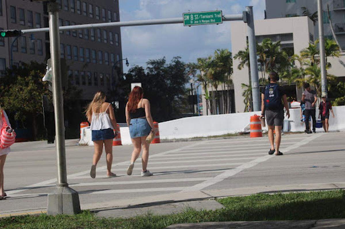 Students cross Southwest Eighth Street near FIU.