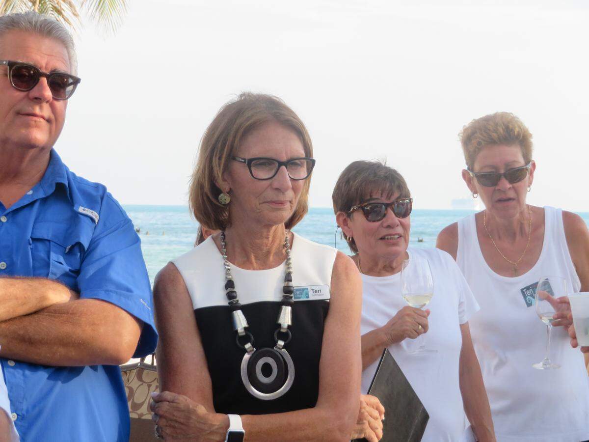 Teri Johnston, center, listens at a political forum earlier this year in Key West.