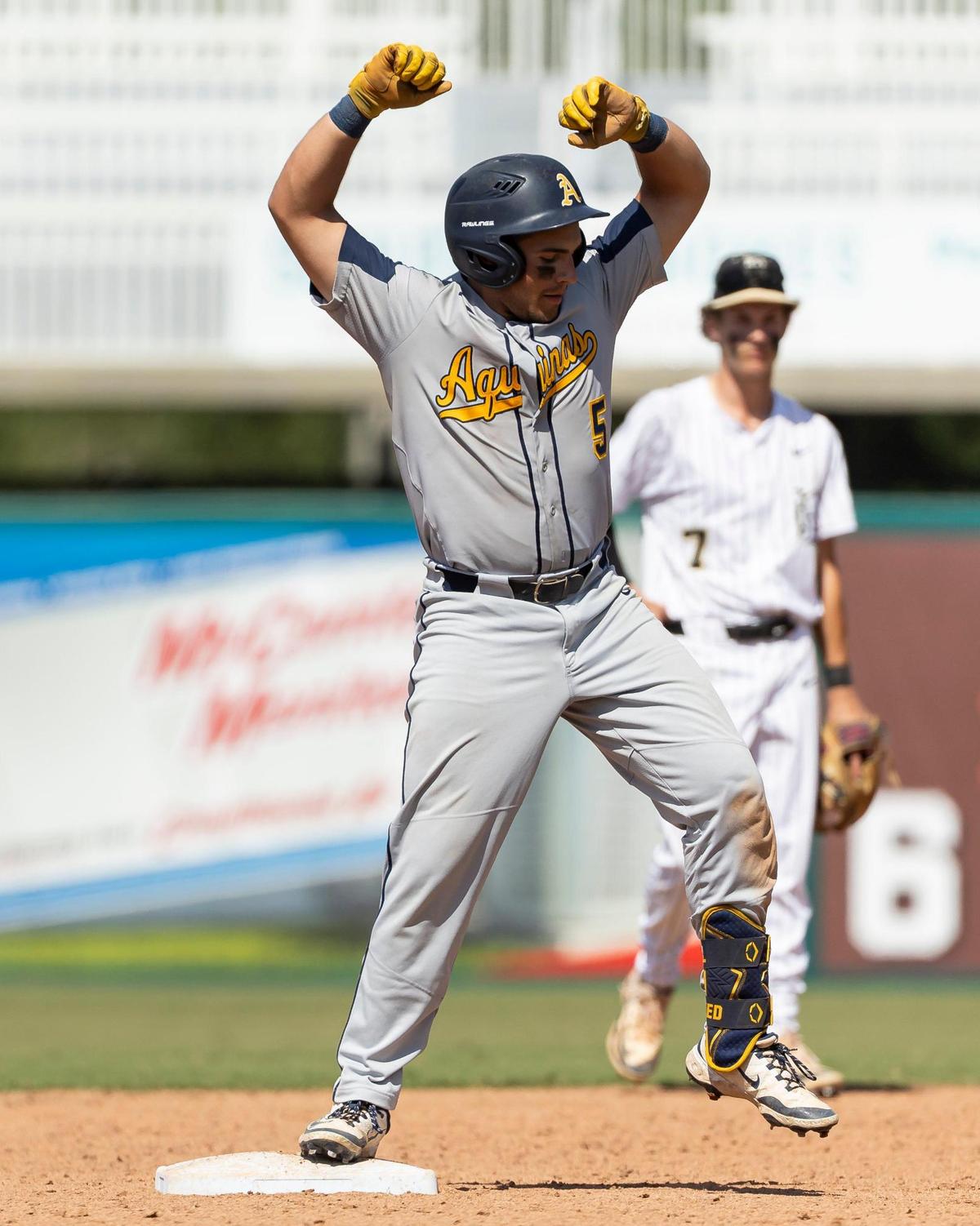 St. Thomas Aquinas Raiders Andrew Alvarez (5) slides safely into second base after hitting a double against the Buchholz Bobcats in the seventh inning of their Class 6A state baseball championship game at Hammond Stadium on Saturday, May 17, 2025, in Fort Myers, Fla.