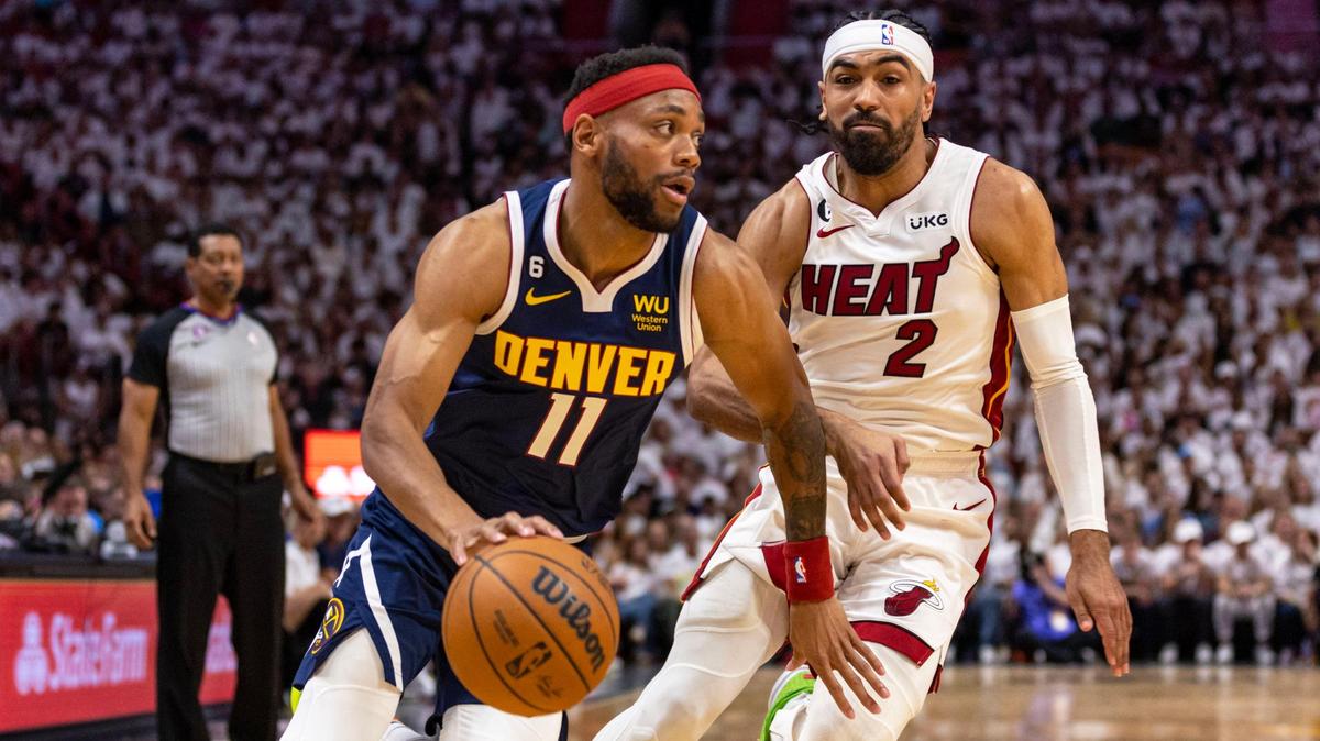 Miami Heat point guard Gabe Vincent (2) defends Denver Nuggets forward Bruce Brown (11) as he drives toward the paint during the first half of Game 4 of the NBA Finals at the Kaseya Center on Friday, June 9, 2023, in downtown Miami, Fla.