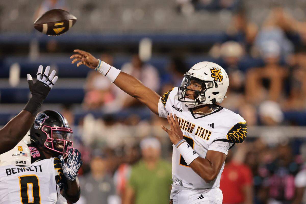 Kennesaw State Owls quarterback Amari Odom (2) passes the football against the FIU Panthers during the first quarter at Pitbull Stadium in Miami, Florida, Tuesday, October 21, 2025.
