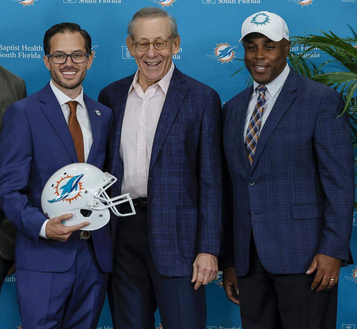New Miami Dolphins head coach Mike McDaniel pose for the picture alongside Dolphins owner Stephen M. Ross and Dolphins Miami general manager Chris Grier during his introductory press conference at Baptist Health Training Complex in Hard Rock Stadium on Thursday, February 10, 2022 in Miami Gardens, Florida.