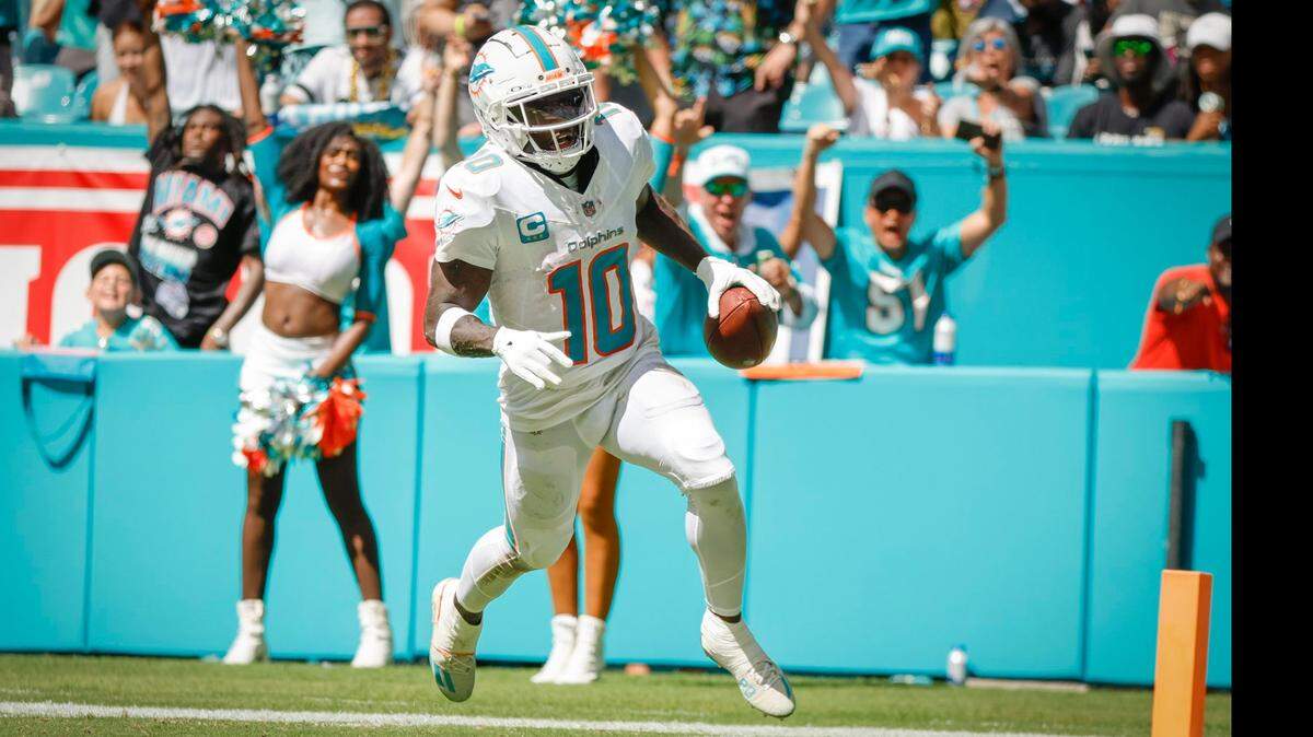 Miami Dolphins wide receiver Tyreek Hill (10) scores in the second half during an NFL football game at Hard Rock Stadium in Miami Gardens, Florida, on Sunday, September 8, 2024.