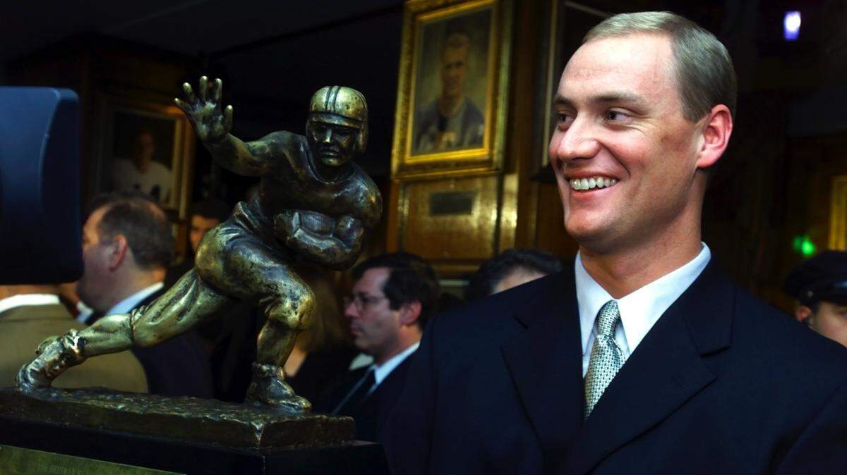 Heisman Trophy winner quarterback Chris Weinke, of Florida State,
smiles  while posing with his trophy Saturday, Dec. 9, 2000, at New York’s
Downtown  Athletic Club. (AP Photo/Suzanne Plunkett, Pool)