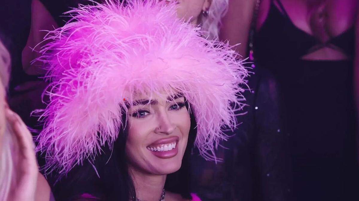Megan Fox wore a pink furry hat and micro-top at Eleven Miami 
PHOTO BY ADINAYEV