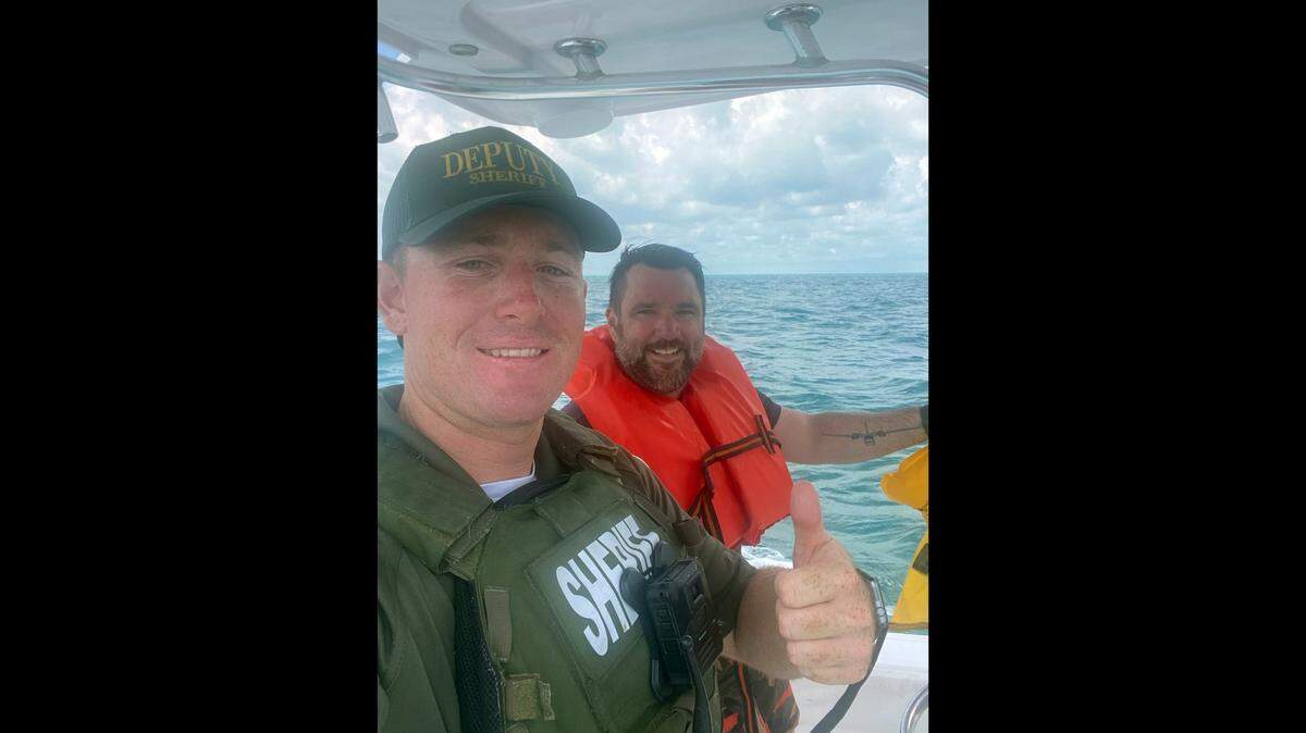 Monroe County Sheriff’s Office deputy Trevor Pike and Adam J. Barney, the pilot of the Aero Commander 500 that went down in waters off the Florida Keys.