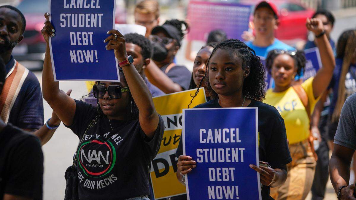 Protesters marched from the Supreme Court heading to the White House on June 30 on the day the United States Supreme Court released its opinion on Biden v. Nebraska.