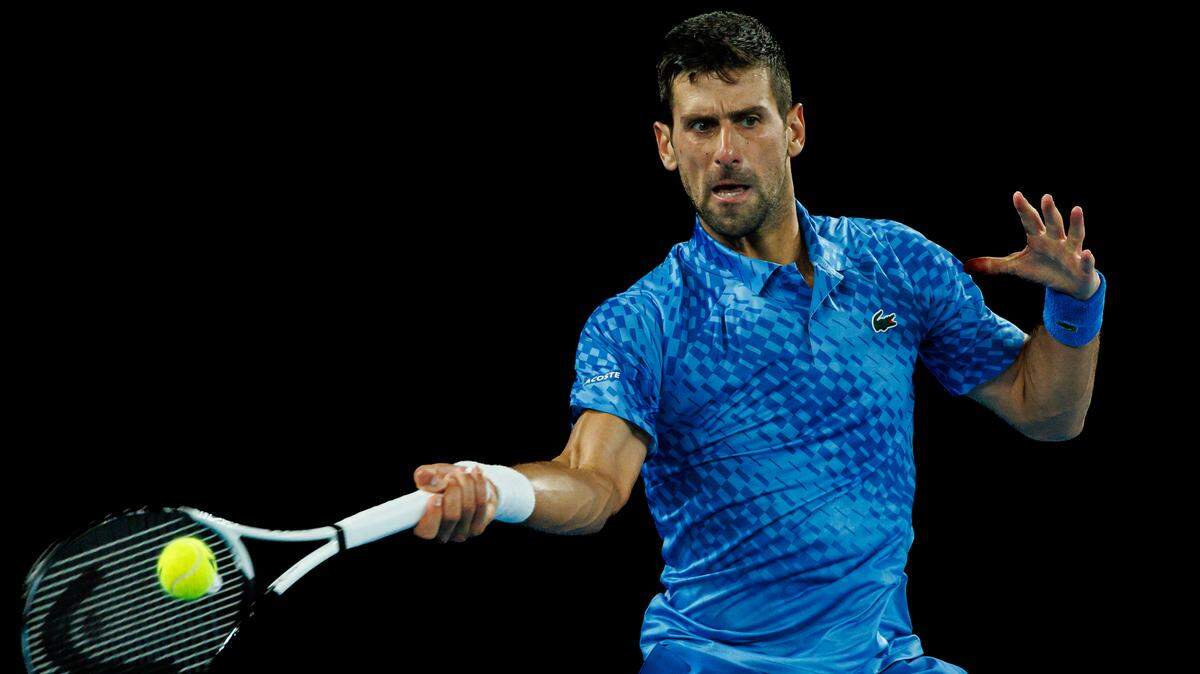 Jan 29, 2023; Melbourne, Victoria, Australia; Novak Djokovic of Serbia hits a shot against Stefanos Tsitsipas of Greece in the men’s final on day fourteen of the 2023 Australian Open tennis tournament at Melbourne Park. Mandatory Credit: Mike Frey-USA TODAY Sports