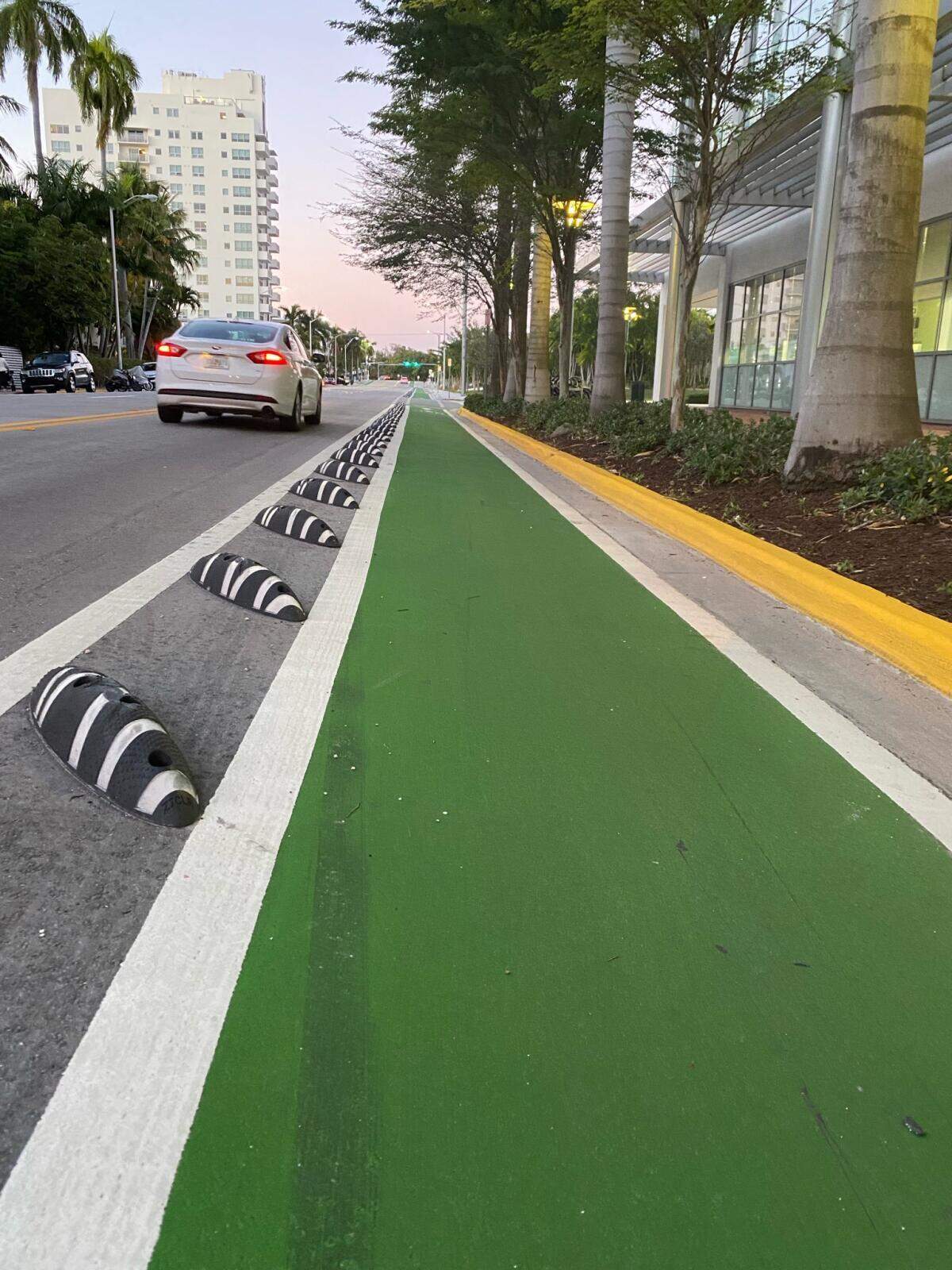 New bike lanes on Miami Beach’s Meridian Avenue are protected from motorized traffic by “armadillo” separators.