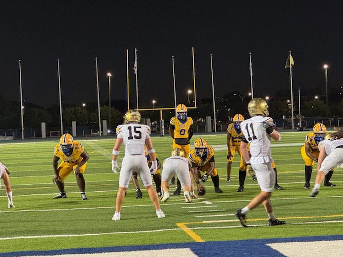 Northwestern quarterback Neiman Lawrence (8) readies to take a snap during the Bulls’ 52-21 win over Orlando Bishop Moore on Friday at Traz Powell Stadium in Miami, Fla.