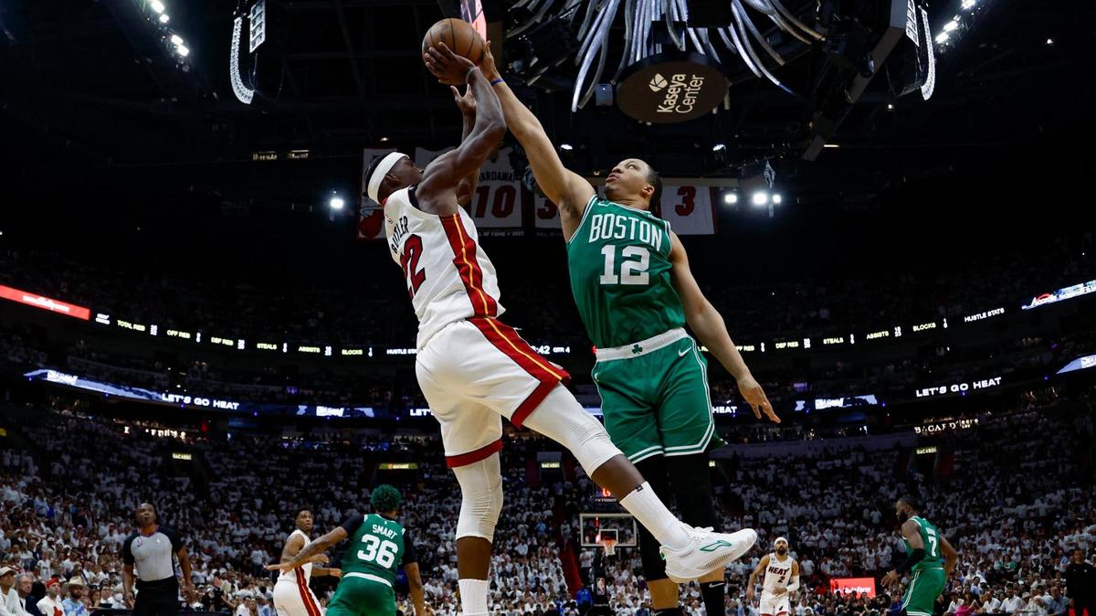 Miami Heat forward Jimmy Butler’s (22) attempt at the basket is blocked by Boston Celtics forward Grant Williams (12) during the fourth quarter in Game 4 of the NBA Eastern Conference Finals at the Kaseya Center in Miami on Tuesday, May 23, 2023.
