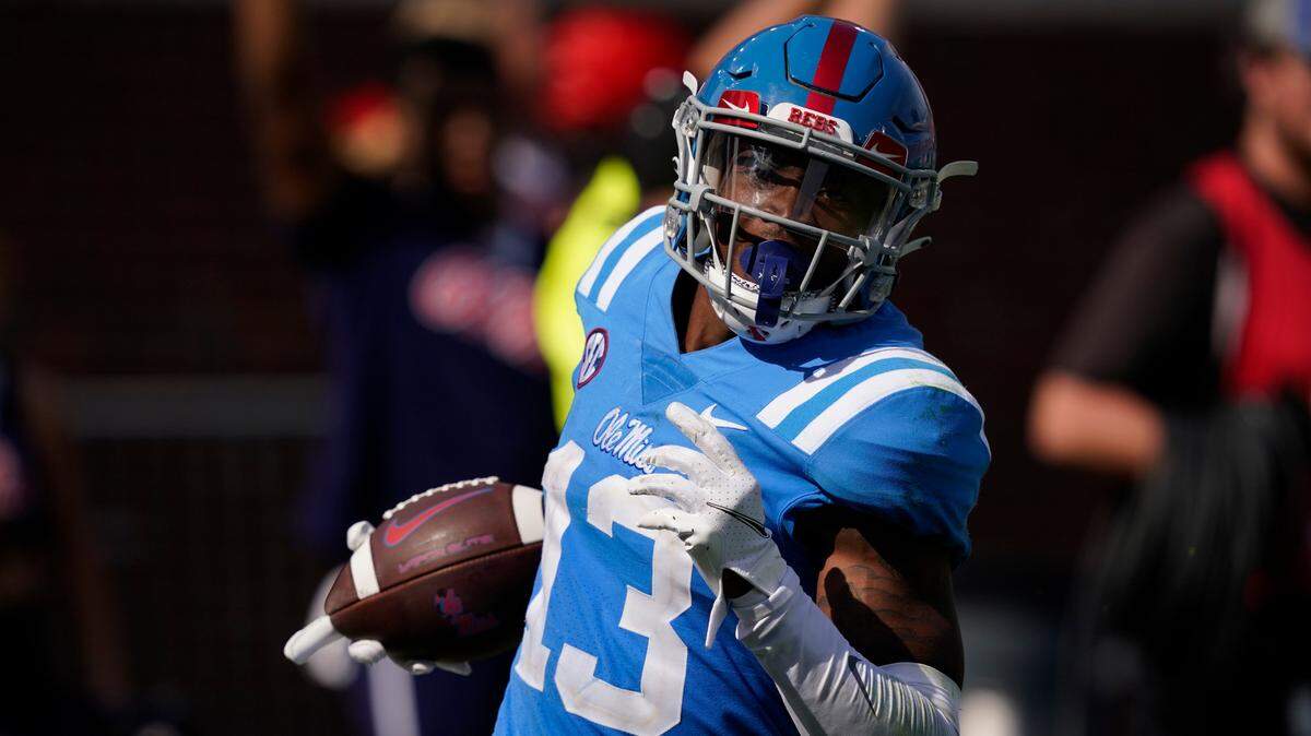 Mississippi wide receiver Braylon Sanders (13) looks upfield as he takes a 68-yard pass into the end zone for a touchdown during the second half of an NCAA college football game against Arkansas, Saturday, Oct. 9, 2021, in Oxford, Miss. Mississippi won 52-51.