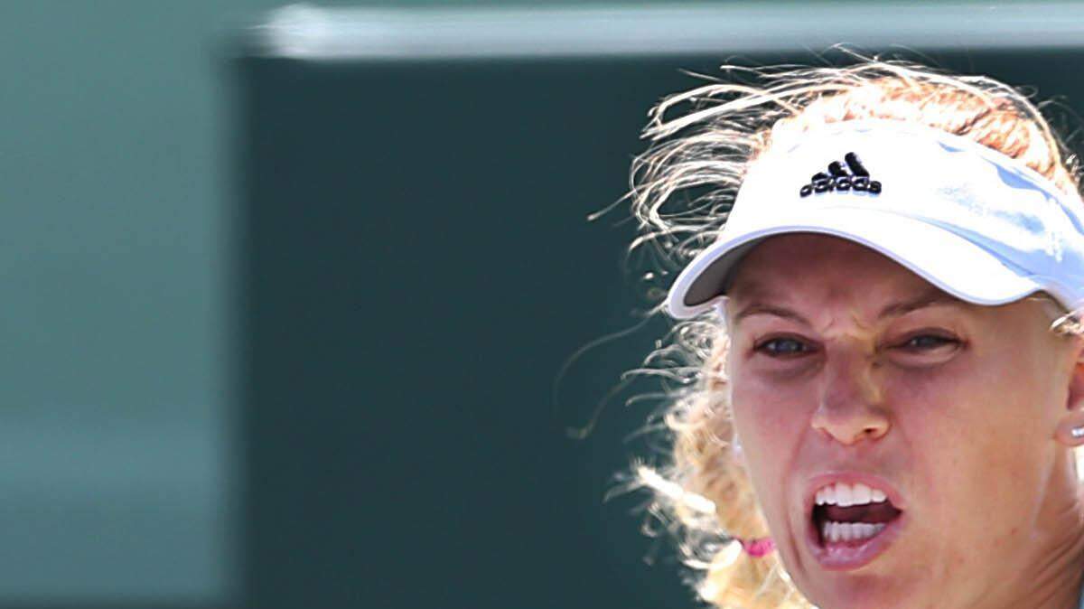 Caroline Wozniack, (DEN), returns against Kaia Kanepi (EST), during the women's singles third round at the Miami Open Tennis 2015, in Key Biscayne Saturday, March 28, 2015.