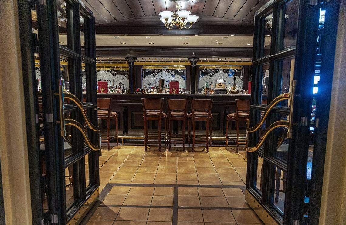 View of the entrance to the Golden Lion Pub on deck two of the Cunard cruise ship Queen Elizabeth', as it sits docked at PortMiami on Thursday, Oct. 16, 2025, in Miami. The vessel arrived around 6 a.m. and will be based in Miami for six months, offering voyages to the Caribbean. After tours and festivities, the ship is scheduled to depart later Thursday on its inaugural 12-night Caribbean cruise.