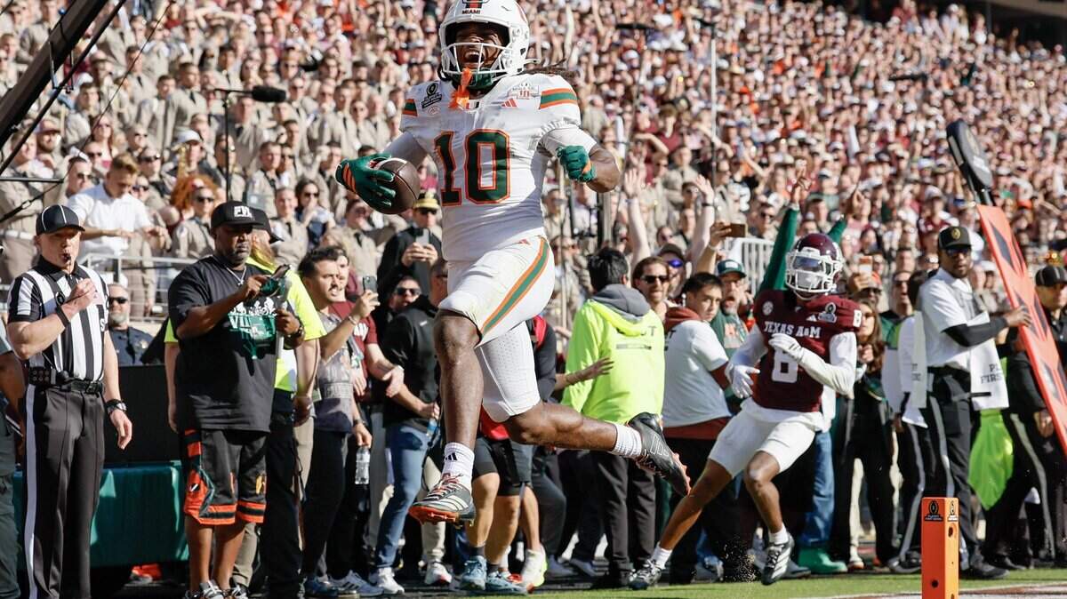 Miami Hurricanes wide receiver Malachi Toney (10) scores the winning touchdown in the fourth quarter against Texas A&M Aggies in the first round of the 2025 College Football Playoff at Kyle Field at College Station, Texas, on Saturday, Dec. 20, 2025. Al Diaz won first place in the FSNE competition for sports photography for Miami Hurricane’s Malachi Toney scores.