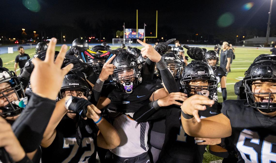 Archbishop Carroll Bulldogs react after they defeated the Westminster Christian Warriors in a high school football game at Tropical Park on Friday, Oct. 21, 2022, in Miami, Fla.