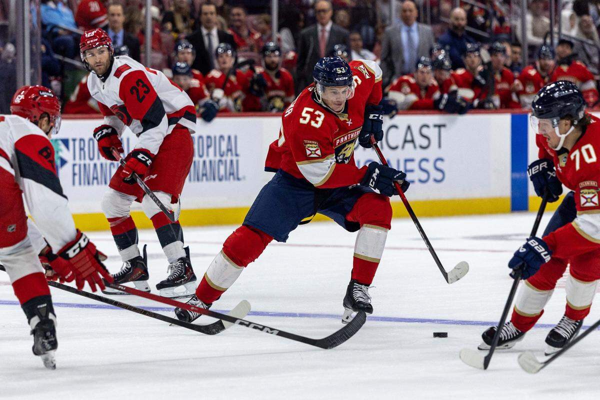 Florida Panthers center Jack Studnicka (53) passes the puck during the third first period of an NHL game against the Carolina Hurricanes at Amerant Bank Arena on Monday, September 29, 2025, in Sunrise, Fla.