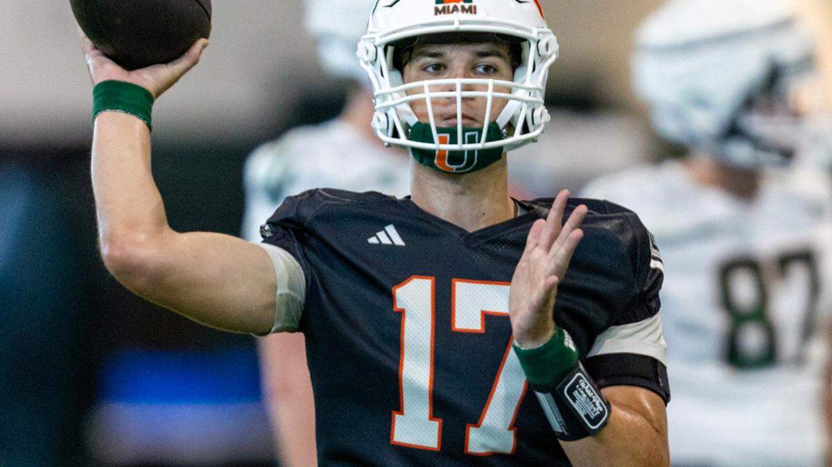 Miami Hurricanes quarterback Emory Williams (17) looks to throw during practice at the Carol Soffer Indoor Practice Facility on Wednesday, July 31, 2024, in Coral Gables, Fla.