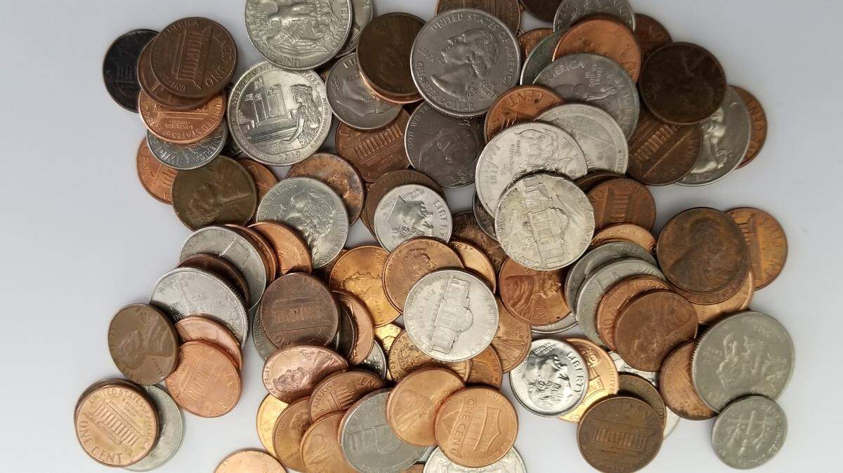 File photo of coins. Authorities in Pennsylvania said a parking official stole $4,314 in meter change.