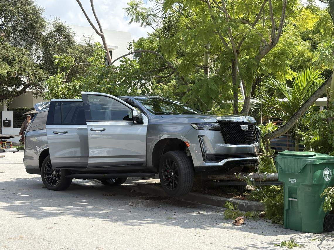 The stolen Cadillac Escalade on Shipping Avenue at New York Street in Coconut Grove on Friday morning, Aug. 22, 2025. A report of this car being stolen from a Coral Gables home on Friday morning led to a Gables police chase that wound up closing streets in the Grove and the lockdown of three Grove schools.