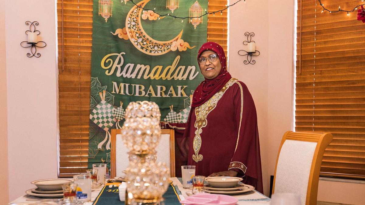 Naima Khan-Ghany is a former Broward educator who led the charge in getting Eid-al-Fitr recognized by Broward Public Schools. Here she stands in her house dining room set up to celebrate Ramadan, the holiest month for Muslims.