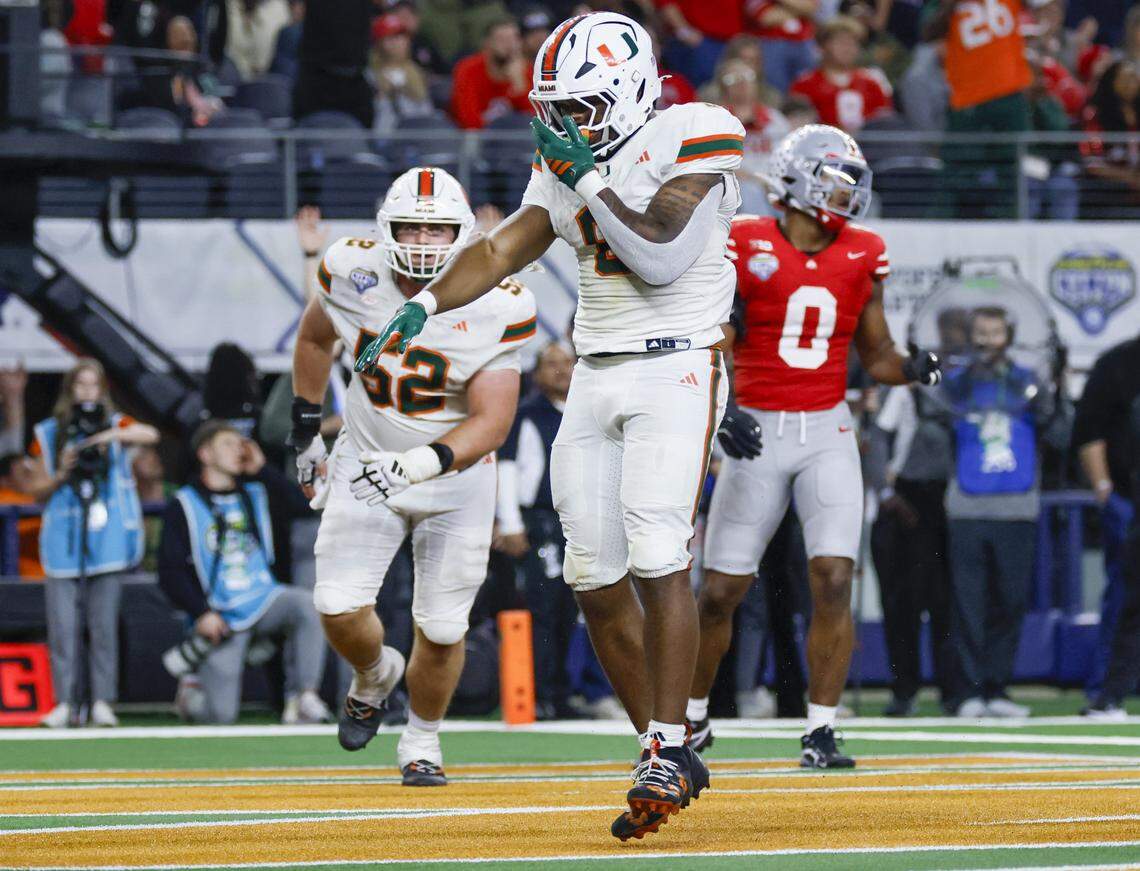 Miami Hurricanes running back Charmar Brown (6) reacts after scoring late in the second half of the College Football Playoff quarterfinal game against the Ohio State Buckeyes in the Cotton Bowl at AT&T Stadium in Arlington, Texas on Wednesday, December 31, 2025.