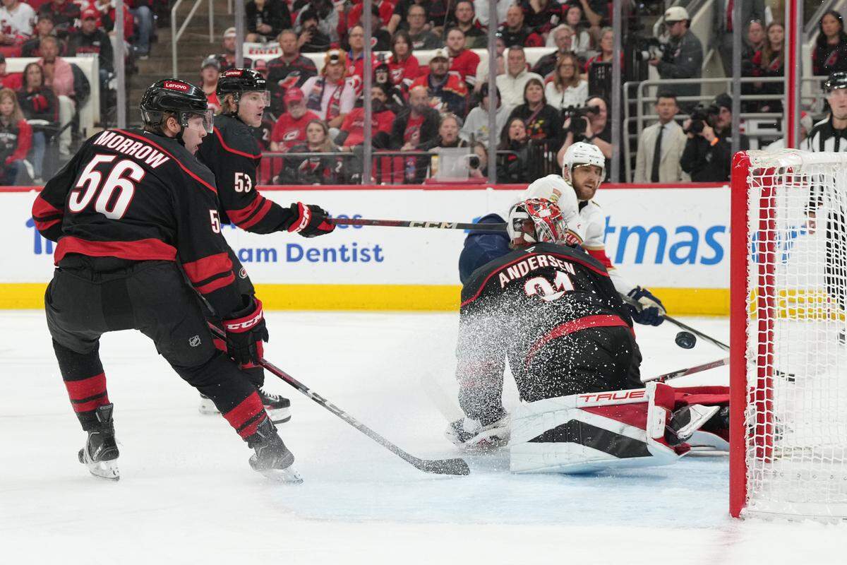 May 20, 2025; Raleigh, North Carolina, USA; Florida Panthers forward A.J. Greer (10) scores against Carolina Hurricanes goaltender Frederik Andersen (31) during the second period in game one of the Eastern Conference Final of the 2025 Stanley Cup Playoffs at Lenovo Center. Mandatory Credit: James Guillory-Imagn Images
