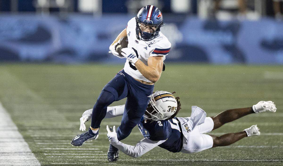 FIU Panthers defensive back Brian Blades II (2) tackles Florida Atlantic University Owls wide receiver Easton Messer (8) in the first half of their Shula Bowl football game at Pitbull Stadium on Saturday, Sept. 13, 2025, in Miami, Fla.