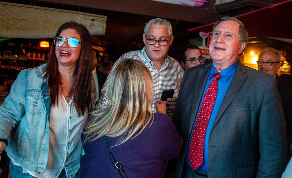 City of Miami Commissioner Joe Carollo celebrates with his wife Marjorie Carollo, at left, and with supporters after winning the reelection for District 3, at the Old’s Havana Cuban Bar and Cocina in Little Havana, on Tuesday, Nov. 2, 2021.