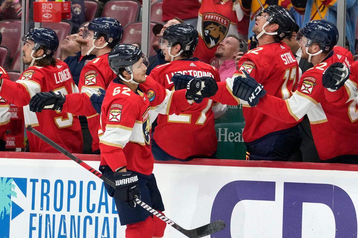 Florida Panthers defenseman Brandon Montour (62) is congratulated after scoring a goal during the first period of an NHL hockey game against the Columbus Blue Jackets, Tuesday, Dec. 13, 2022, in Sunrise, Fla. (AP Photo/Lynne Sladky)