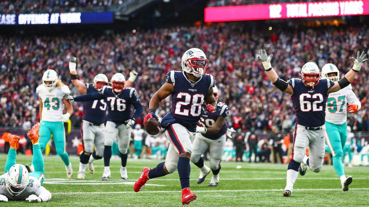 James White #28 of the New England Patriots scores a touchdown in the fourth quarter of a game against the Miami Dolphins at Gillette Stadium on December 29, 2019 in Foxborough, Massachusetts.