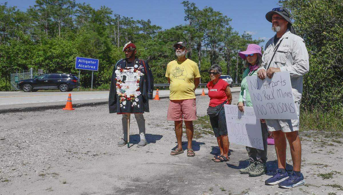 People gather during a May Day protest rally outside of Alligator Alcatraz located at the Dade-Collier Training and Transition Airport in the Florida Everglades, Ochopee, Florida, on Friday, May 1, 2026.
