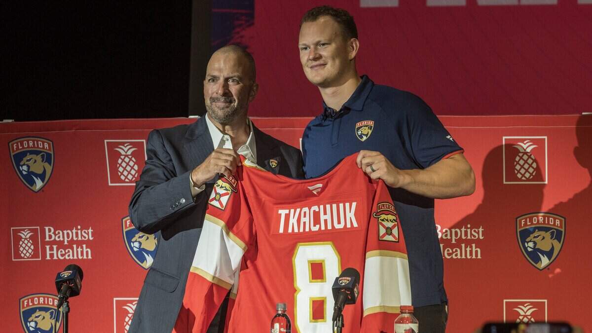 Bill Zito (left), President of Hockey Operations & General Manager pose with the new Florida Panthers' forward Brady Tkachuk, during a press conference at the War Memorial Auditorium in Fort Lauderdale, on Tuesday June 23, 2026.