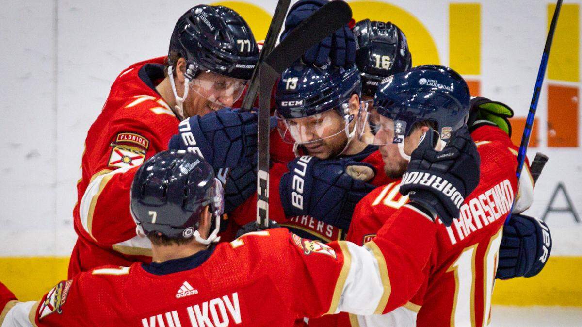 Florida Panthers hug Florida Panthers center Sam Reinhart (13) after he scores a goal during the second period of a hockey game on Tuesday, April 16, 2024, at Amerant Bank Arena in Sunrise, Fla. The Florida Panthers scored 4 goals in the period to take the lead 4-2 against the Toronto Maple Leafs.