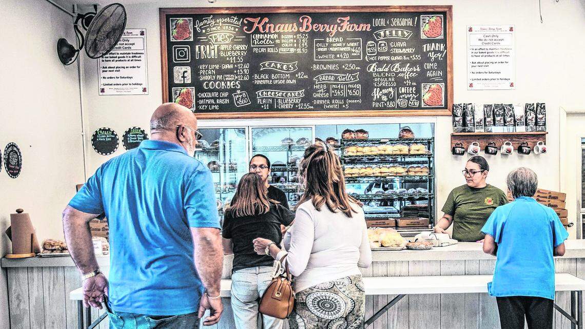 Customers line up for cinnamon rolls, bread, jams and pies and other homemade goodies at Knaus Berry Farm in Homestead.