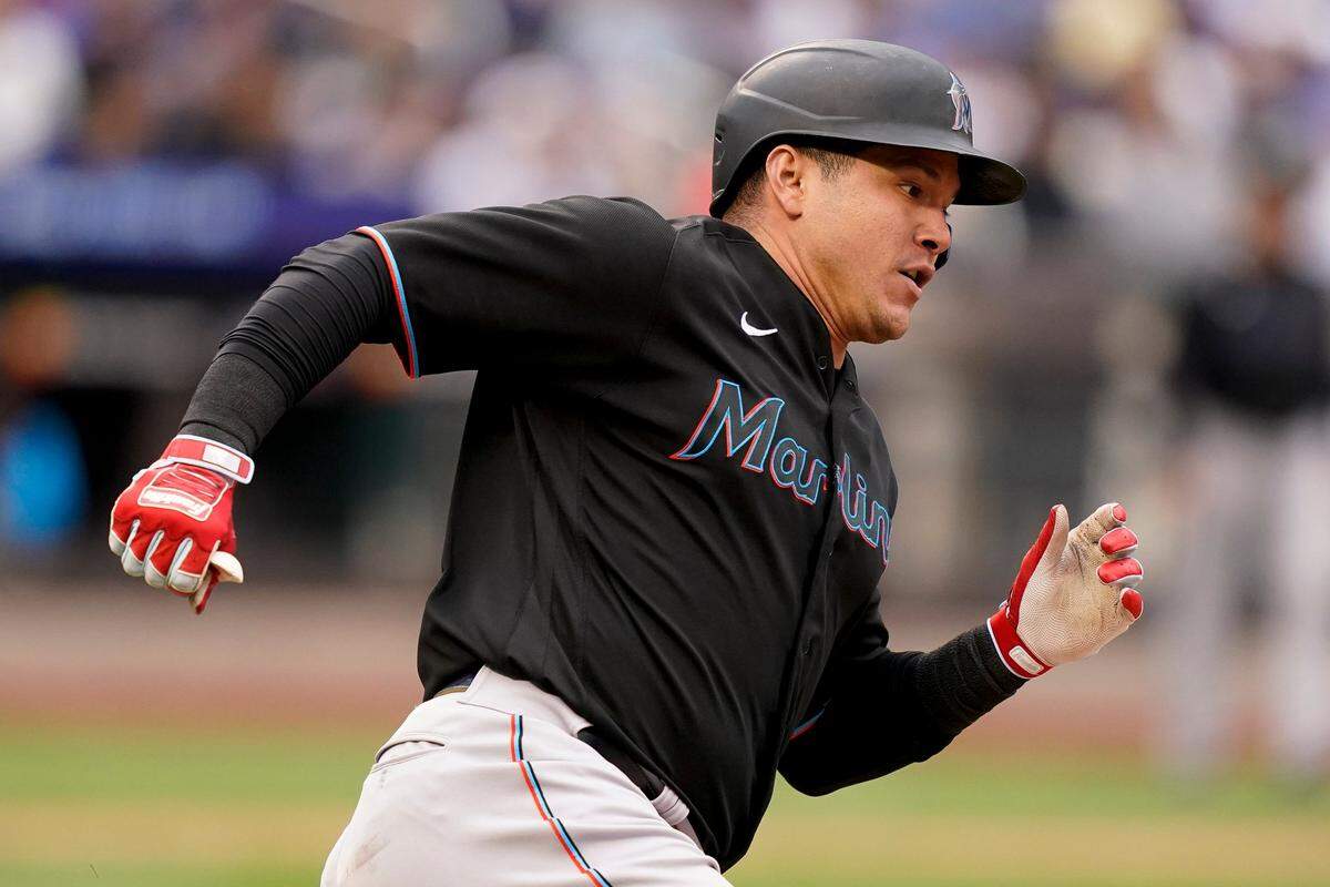 Miami Marlins’ Avisail Garcia rounds first after hitting an RBI double off New York Mets starting pitcher Taijuan Walker (99) in the seventh inning of a baseball game, Saturday, June 18, 2022, in New York. (AP Photo/John Minchillo)