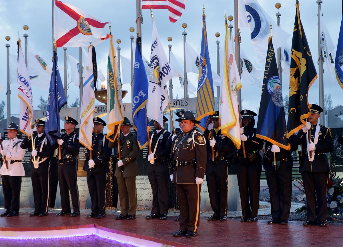 A combine honor guard presents the colors at the Law Enforcement Officers Memorial as part of the 37th annual Miami-Dade Law Enforcement Officers Memorial Ceremony at Tropical Park on Thursday, May 3, 2018.