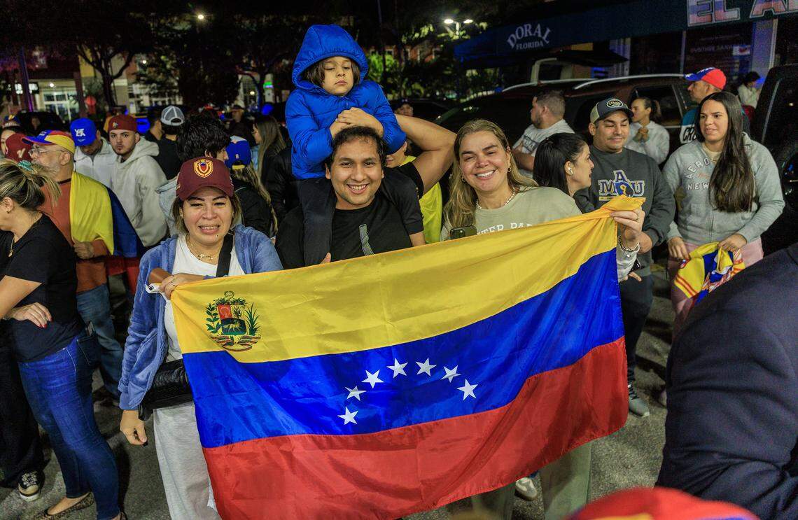 From left- Karina Delgado, Pablo Aldana, Tommy Aldana (kid) and Luisa Rodriguez Venezuelans exiles living in South Florida celebrate outside of El Arepazo in Doral, Florida, after the United States attacked Venezuela and captured Venezuelan leader Nicolás Maduro,  on Jan. 3, 2026.