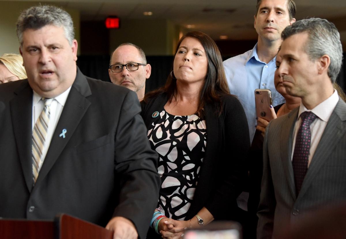 Tony Montalto, left, speaks during a press conference in August with other family members of Parkland shooting victims, including Fred Guttenberg, April Schentrup, and Max Schachter, in Sunrise.
