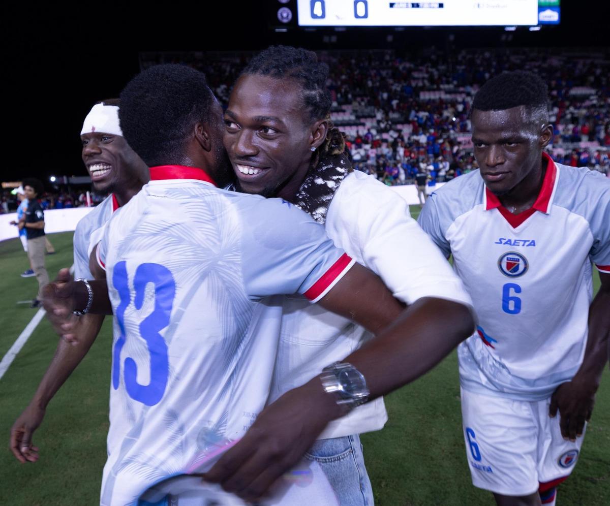 Woodensky Pierre, midfielder of the Haitian national team, is greeted by teammates after arriving in Fort Lauderdale on Tuesday, June 2, 2026, in time to see the team rout New Zealand, 4-0, in a pre-World Cup friendly game. Pierre’s arrival in the United States had been delayed because of issues in securing a U.S. visa.