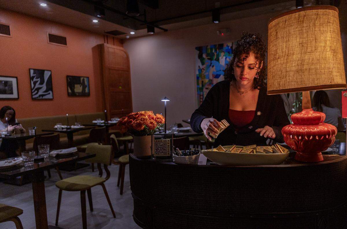 Hostess Sofia Gonzalez works the front desk at the recently opened Tin Tin, Cuban Cuisine Restaurant in Little Havana, on Friday January 09, 2026.