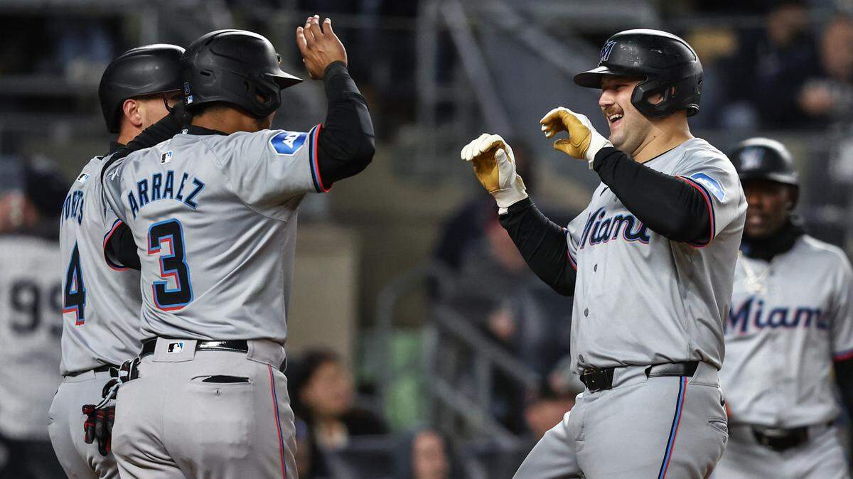 Apr 10, 2024; Bronx, New York, USA; Miami Marlins third baseman Jake Burger (36) is greeted by second baseman Luis Arraez (3) after hitting a three run home run in the third inning against the New York Yankees at Yankee Stadium.