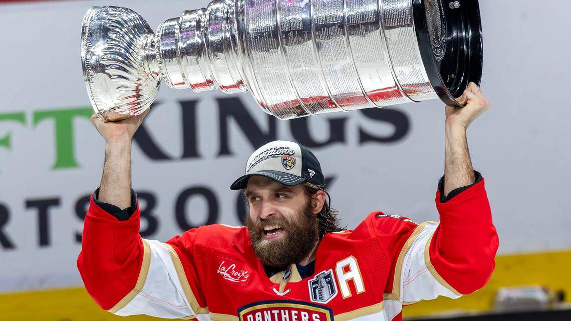 Florida Panthers defenseman Aaron Ekblad (5) lifts the Stanley Cup after defeating the Edmonton Oilers 5-1 in Game 6 of the Final at Amerant Bank Arena in Sunrise, Fla., on Tuesday, June 17, 2025, clinching the NHL championship.
