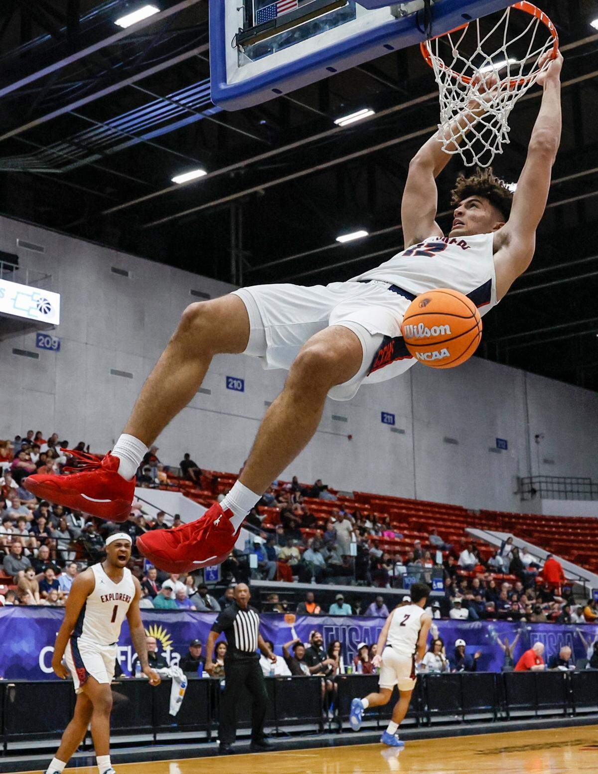 Columbus High School’s Cameron Boozer (12) dunks the ball against Windermere in the second half of the FHSAA Class 7A Final for Boys High School Basketball State Championship.