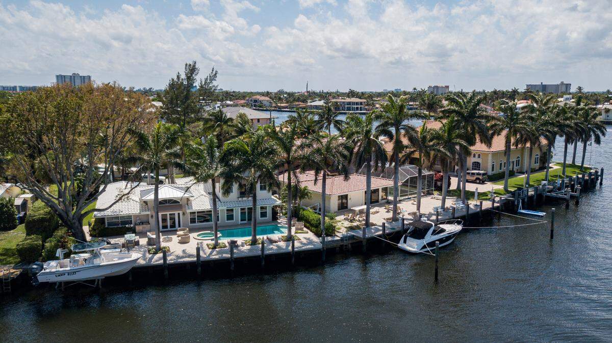 Above: Aerial view of single-family homes off Lake Santa Barbara in Pompano Beach, Florida on Monday, April 26, 2021.