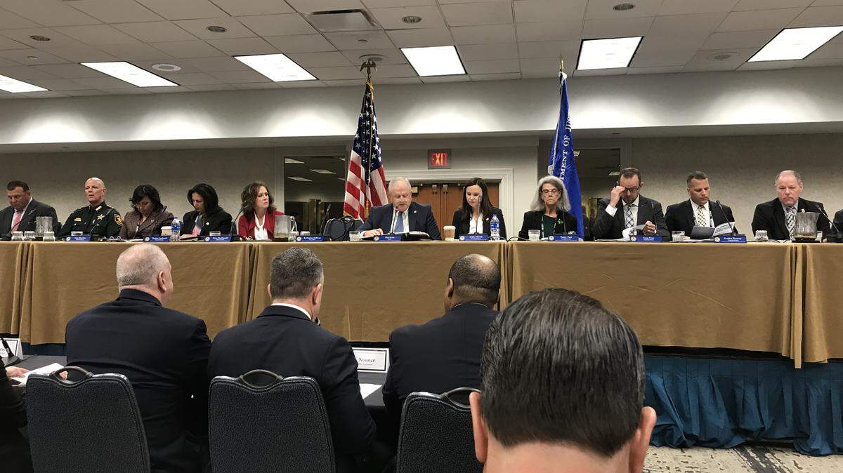 The President’s Commission on Law Enforcement spent Thursday learning about police officer wellness. The group’s chairman, Phil Keith, center with white hair, gaveled in the group’s meeting on Thursday in downtown Miami.
