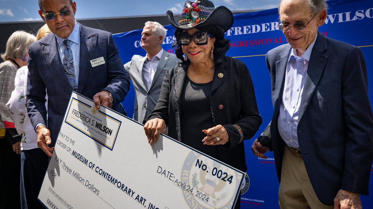 Congresswoman Frederica Wilson, center, presents a $3 million check to Board Chairman Dr. Rudolph Moise, left, and William Lehman Jr., Chairman Emeritus, during a press conference on Wednesday, April 24, 2024, at the Museum of Contemporary Art in North Miami. The museum intends on using the money to create more gallery space inside the building and renovate some of the existing spaces.